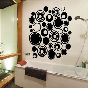 Pebbles wall decals kit with mixed-size circular decals in black and white