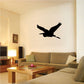Vinyl wall decal with black pelican silhouette in flight