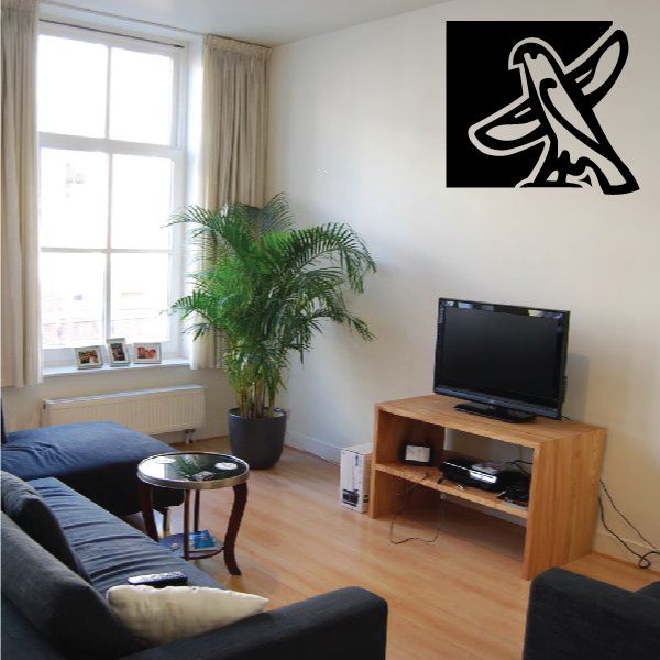 Falcon wall decal in black square with white outline, perched bird graphic