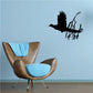 Fleeing pheasant wall decal with black bird silhouette and grass branches on blue wall