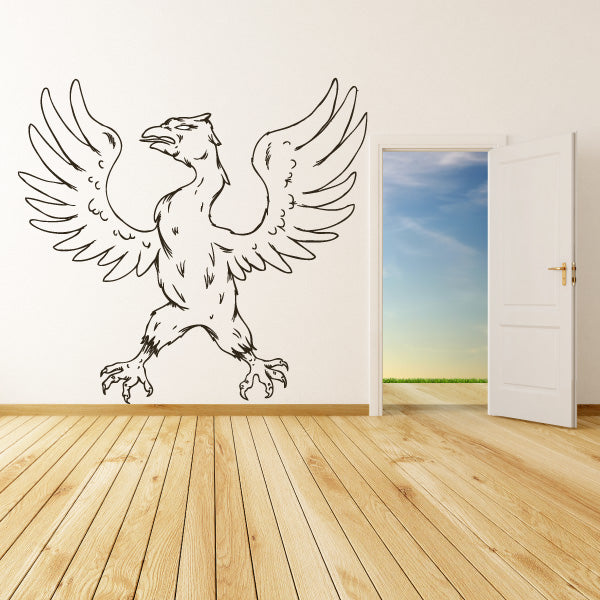 Outlined phoenix decal with broad spread wings and talon feet, black line art