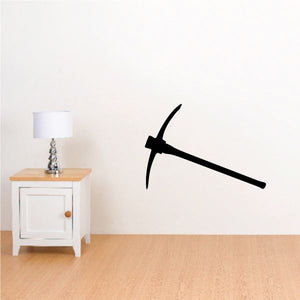 Black pickaxe wall decal with handle and curved head
