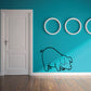 Pig sniffing wall decal with black outline and three white circles accents