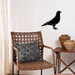 Pigeon decal featuring a black bird silhouette on a light wall