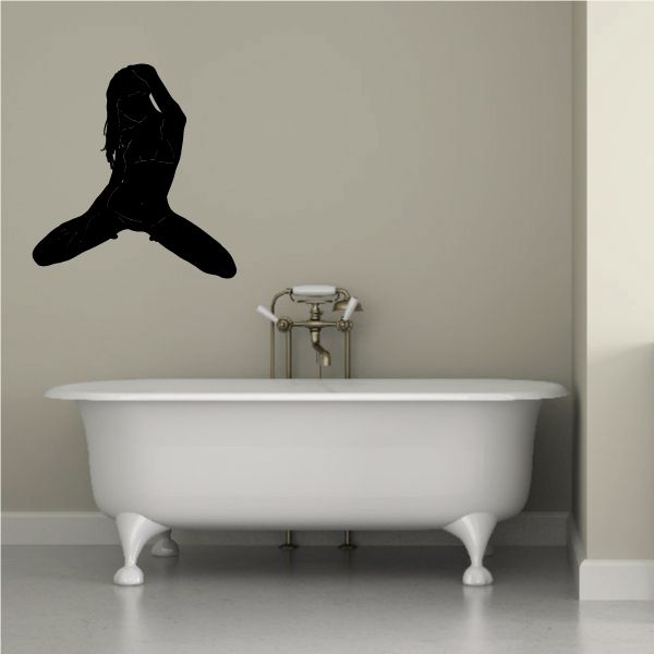 Playful kneeling woman silhouette wall decal, dark black