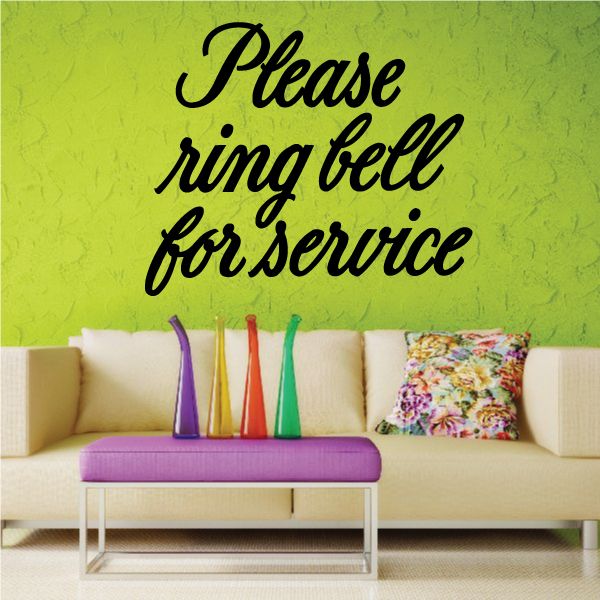 Wall decal text in black cursive reading 'Please ring bell for service'.