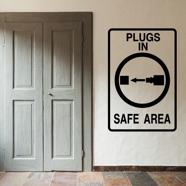 Vinyl decal sign reading “PLUGS IN” and “SAFE AREA” with plug-arrow icon