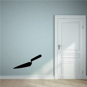 Pointed masonry trowel wall decal, black silhouette.