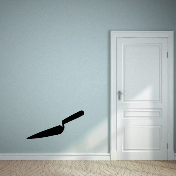 Pointed masonry trowel wall decal, black silhouette.