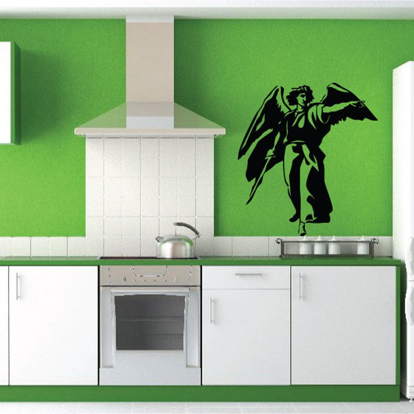 Pointing angel wall decal, black silhouette with raised arm on green wall