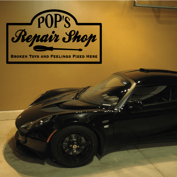 Repair shop wall decal with Pop's logo, wrench graphic, and Broken toys and feelings text