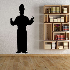 Standing monk silhouette decal with raised hands, dark vinyl wall sticker