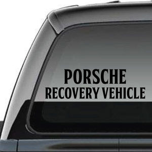 Porsche recovery vehicle decal with black text on a car window