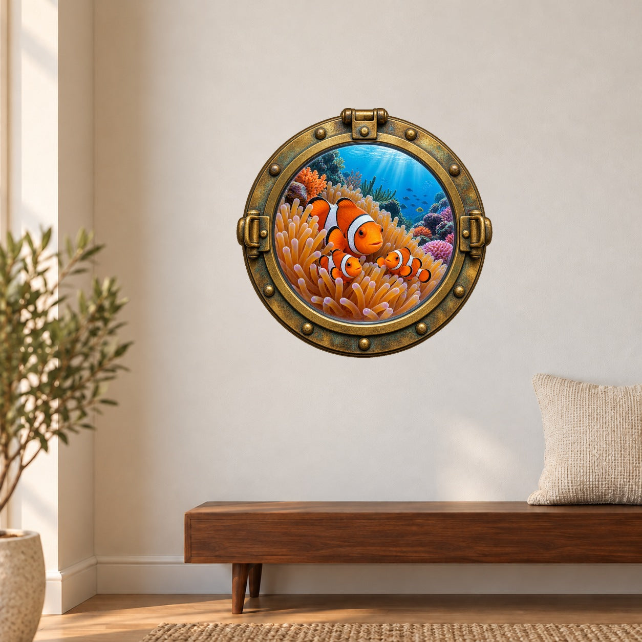 Round porthole wall sticker with a brass-look frame and clownfish among coral