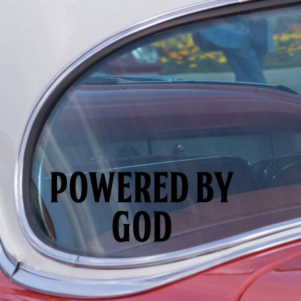 Powered by God decal, bold black text with green outline on window