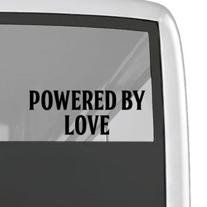 Powered By Love decal with black lettering on a clear surface