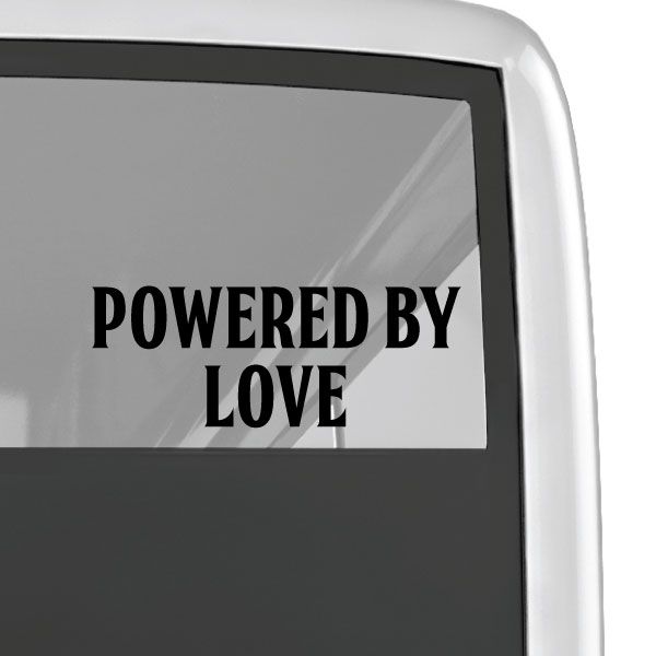 Powered By Love decal with black lettering on a clear surface