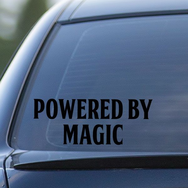 Powered by Magic decal with bold black lettering on a light blue surface