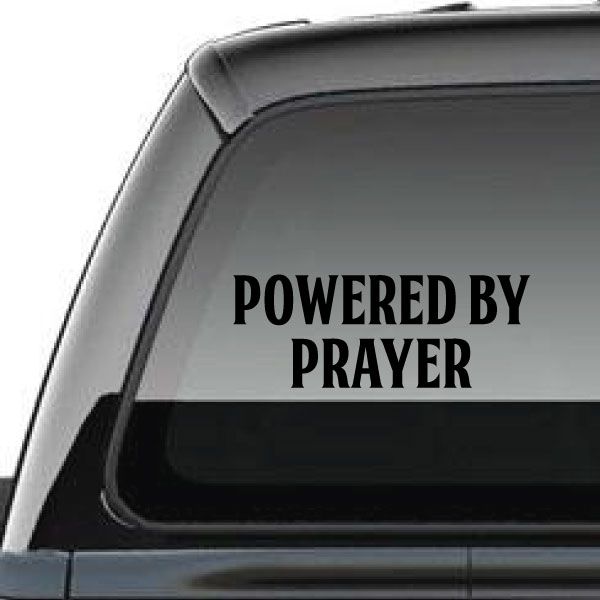 Powered by Prayer window decal with black lettering on light gray surface