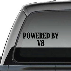Powered By v8 decal with POWERED BY V8 text on vehicle window