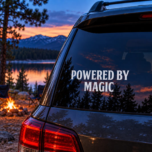 Vehicle rear window decal with text “POWERED BY MAGIC”