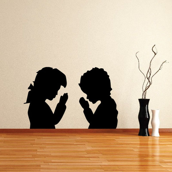 Praying children decal with two black silhouette figures kneeling in prayer