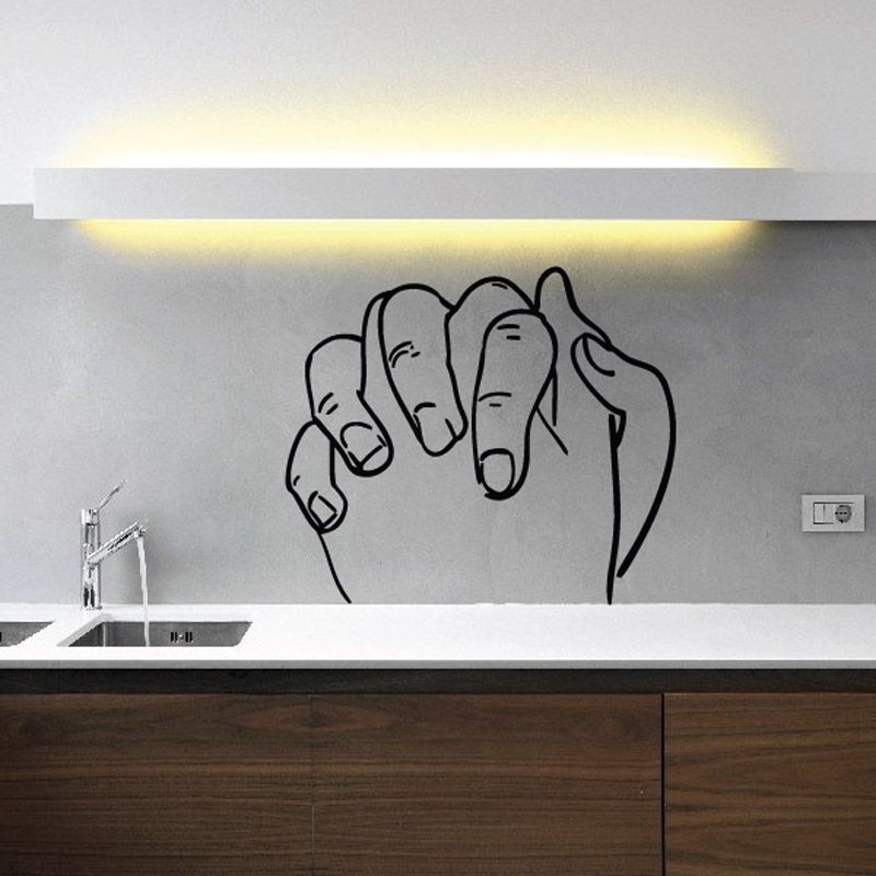 Praying hands wall decal with black outline design on a light surface