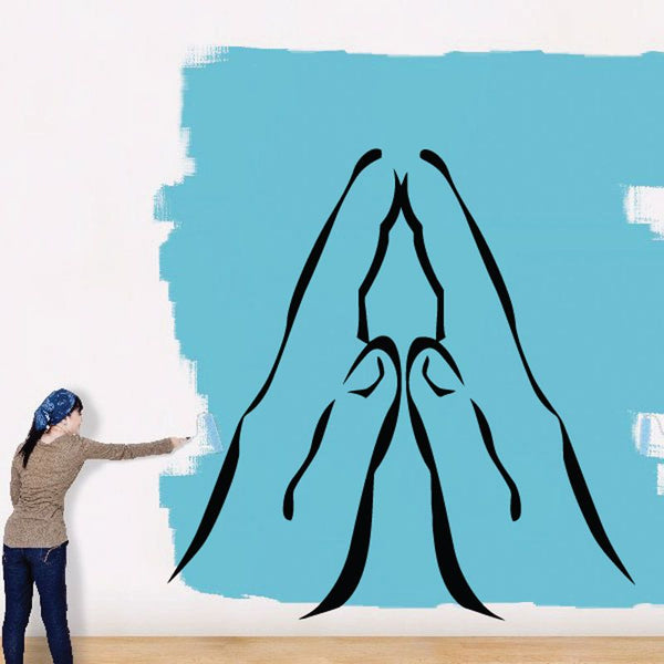 Praying hands decal with simple black outline on blue background