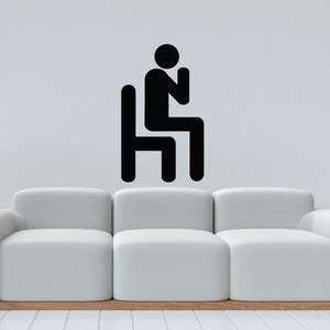 Praying in a Chair wall decal with seated praying figure icon, black