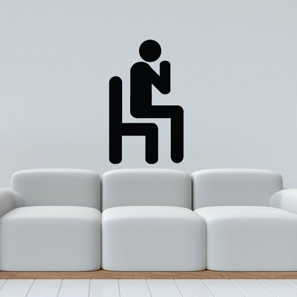 Praying in a Chair wall decal with seated praying figure icon, black