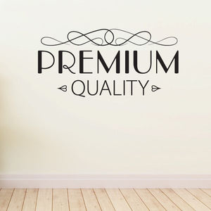 Vinyl wall decal with "PREMIUM QUALITY" text and decorative swirls, black.