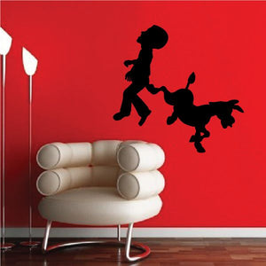 Barrack Obama getting kicked decal: black silhouette of person kicking dog