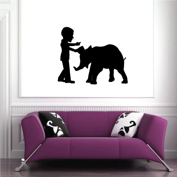 Wall decal of a person talking to an elephant