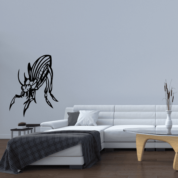 Preying beetle decal sticker, black insect silhouette on light wall.