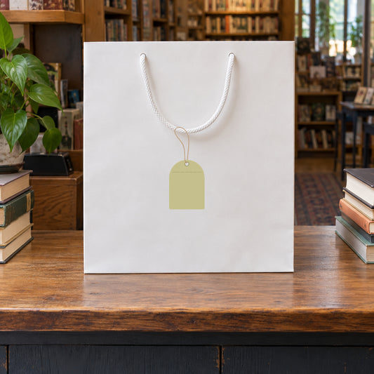 White gift bag with hanging price tag on a string
