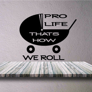 Stroller decal reading 'PRO LIFE, THAT'S HOW WE ROLL' with wheel icons