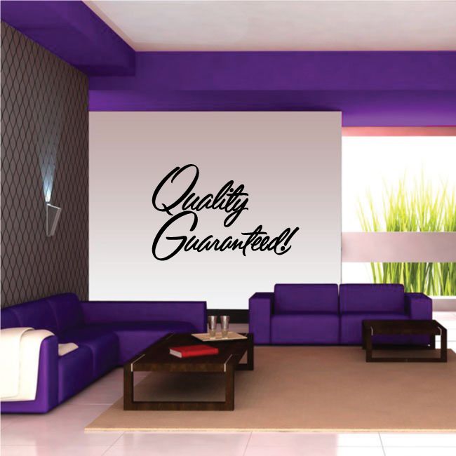 Vinyl wall decal with black script text reading “Quality Guaranteed!”