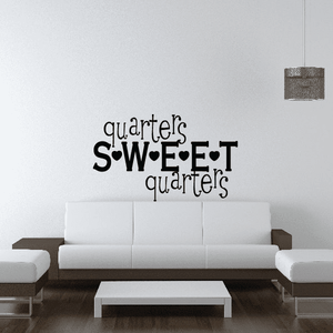 Black wall decal text: 'quarters Sweet quarter' in playful script