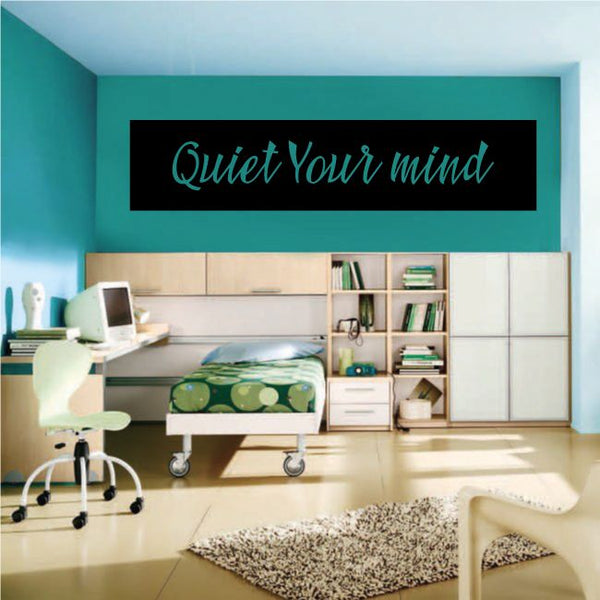 Wall decal with black rectangle and teal cursive "Quiet Your mind" text