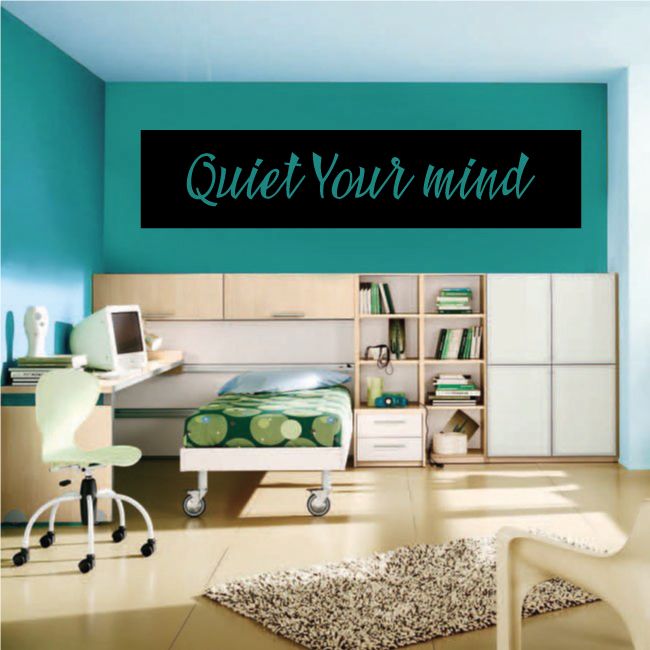 Wall decal with black rectangle and teal cursive "Quiet Your mind" text