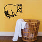 Raccoon grooming decal featuring a black outline raccoon sitting and reaching