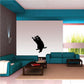 Leaping raccoon wall decal in black with white background