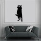 Black raccoon decal standing on hind legs with raised paws