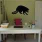 Black raccoon wall decal with paw raised