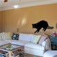 Reaching raccoon wall decal in black