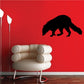Black raccoon sniffing decal with tail and paws silhouette
