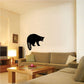 Black raccoon silhouette turning wall decal