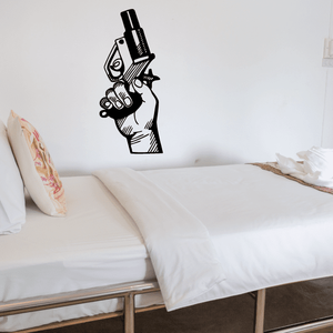 Vinyl decal of a black hand holding a starting gun silhouette