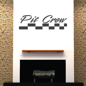 Pit Crew wall decal with black cursive text and checkered racing strip