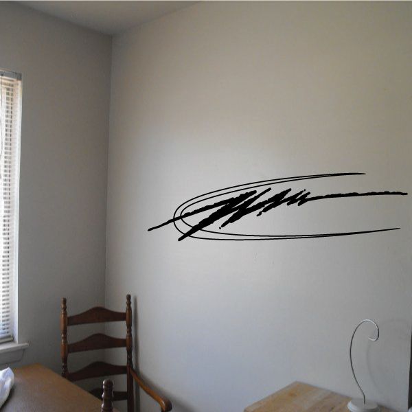 Racing vehicle pinstripe vinyl decal with black curved lettering on wall